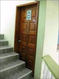 A staircase in front of a door